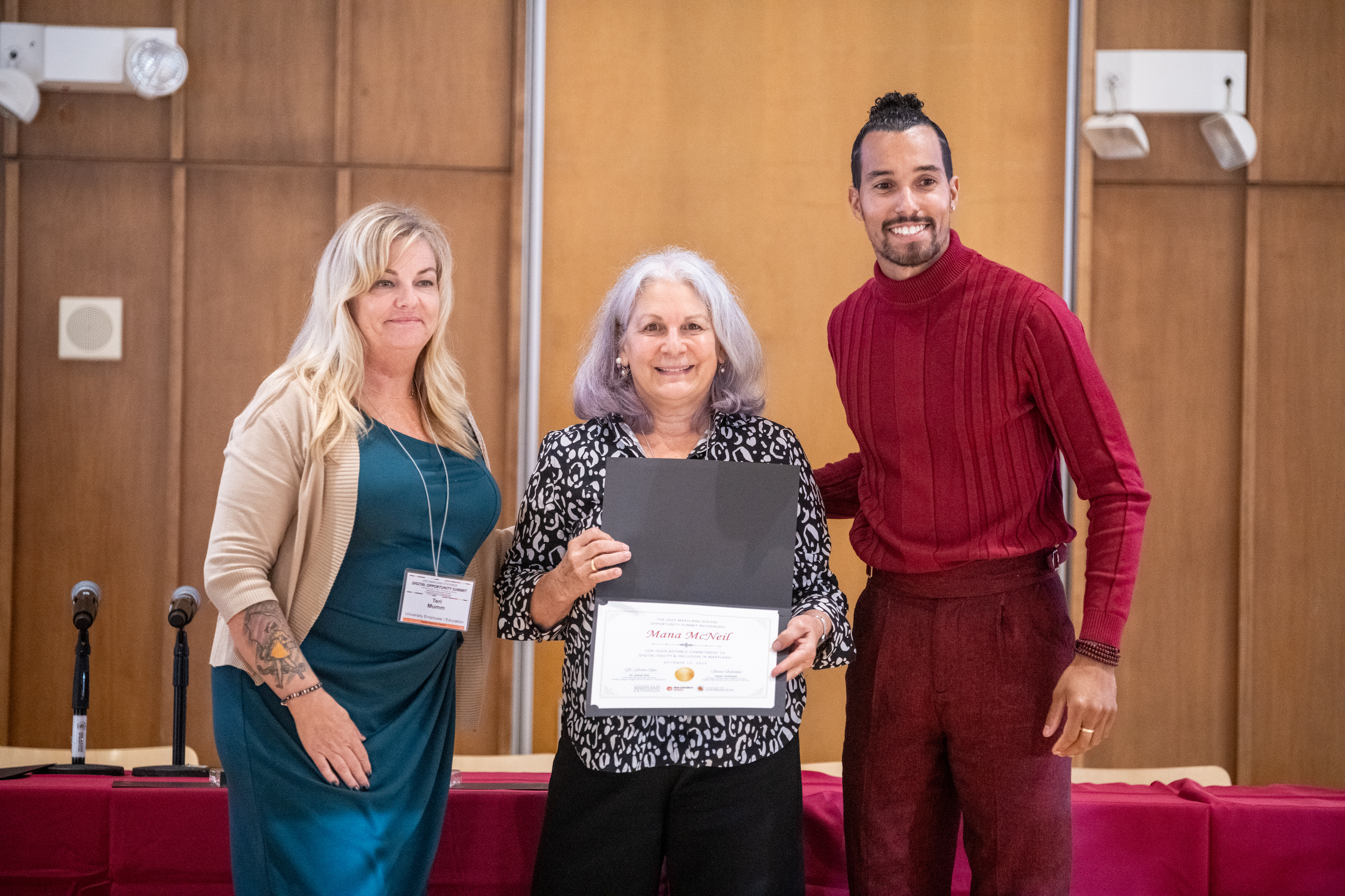 Mana McNeil accepts the Program Notable Mention Award on behalf of CareerCatchers, Inc.